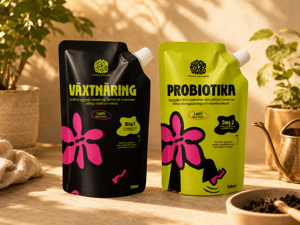 Two packaging units labeled 'Växtnäring' and 'Probiotika' on a wooden surface with plants in the background.